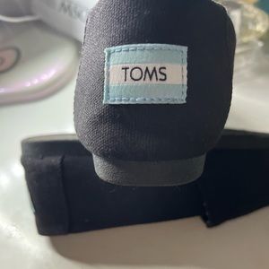 Black Toms slip on